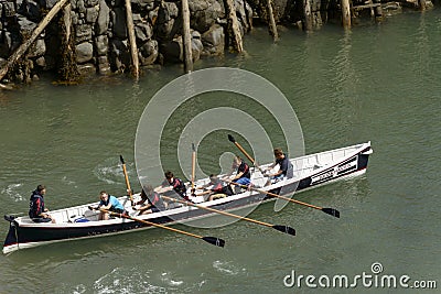 Rowing in harbour at Clovelly, Devon