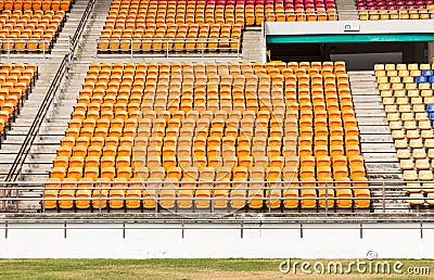 Rows of empty plastic stadium seats