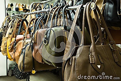 Rows of leather bags in store.