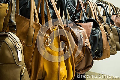 Rows of leather bags in store.