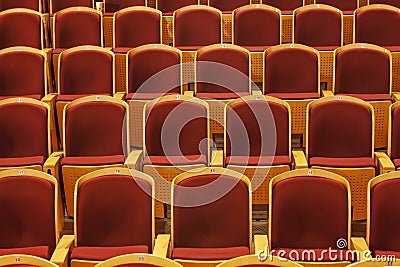 Rows of red theater seats
