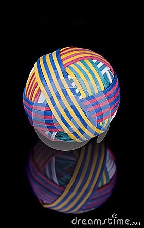 Rubber band ball on black surface