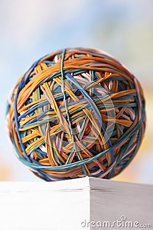 Rubber Band Ball On Book