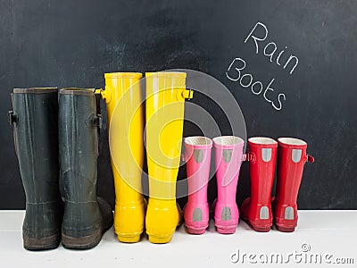 Rubber boots against a blackboard
