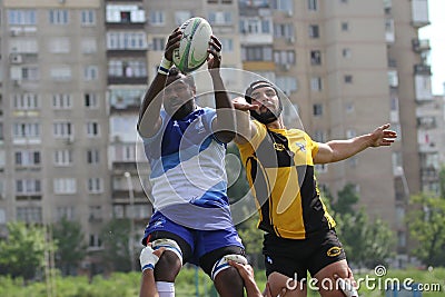 Rugby players fight for ball