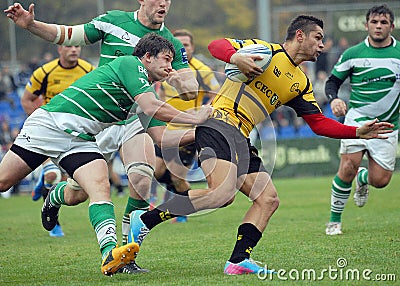 Rugby players fight for ball