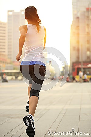 Runner athlete running on city street