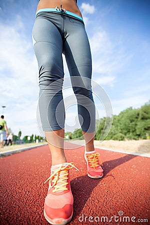 Runner feet running on road,woman fitness and welness concept.