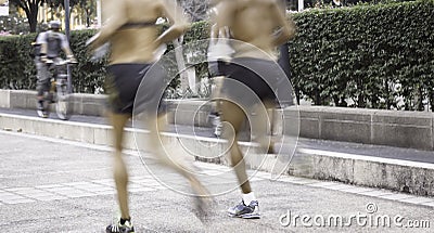 Running man on running lane,aged blurred motion
