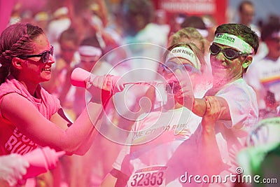 Running people at a color run in Cologne