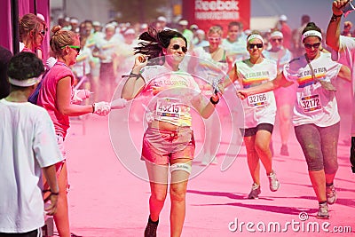 Running people at a color run in Cologne