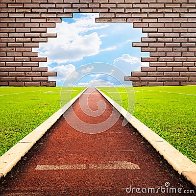 Running track through brick with one lanes to sky