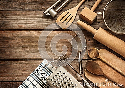 Rural kitchen utensils on vintage planked wood table