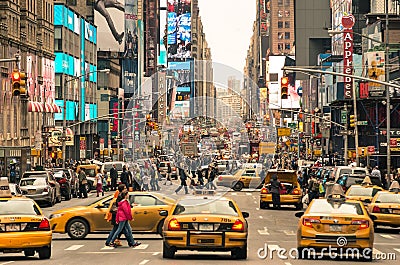 Rush hour with cabs and melting pot people in New York