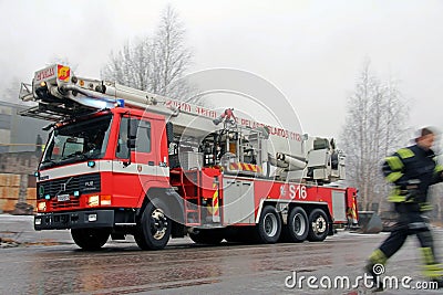 Rushed Fireman and Volvo FL12 Fire Engine Arriving at Fire Scene