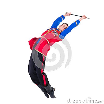 Russian cossack dance. Young dancer posing with sword