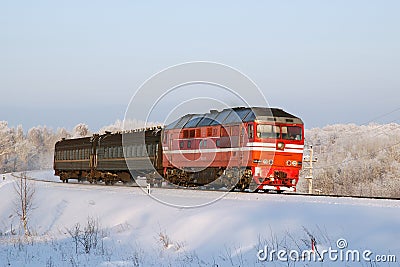 Russian diesel locomotive with passenger train