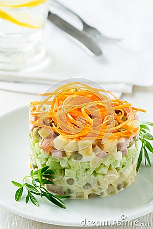 Russian salad Olivier with carrot on the top