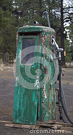 Rusty old green gas pump with personality