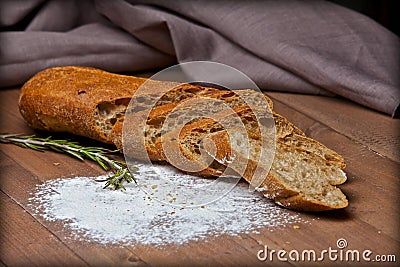 Rye crisp bread with flour on wooden table