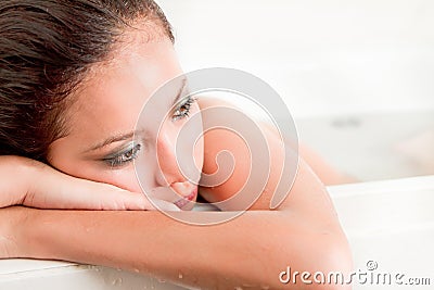 Sad beautiful thinking women in bath tub