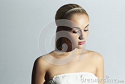 Sad bride in white dress. Beautiful blond woman