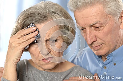 Sad elder couple