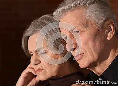 Sad elder couple