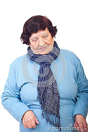 Sad elderly woman looking down