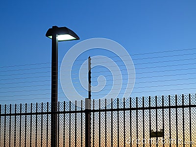 Safety fence with spotlight on by night