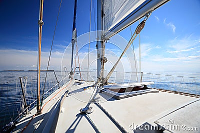 Sailboat yacht sailing in blue sea. Tourism