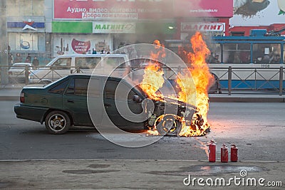 Fire from the car engine hood on city street