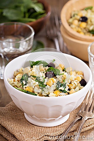 Salad with rice, chickpeas, spinach, raisins