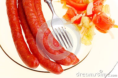 Salad sausage on plate isolated