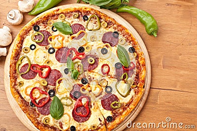 Salami and vegetable pizza
