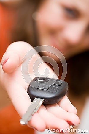 Sales woman offering car keys