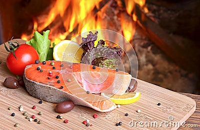 Salmon Steak on a background of a burning flame