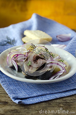 Salted herring with boiled potatoes and onions