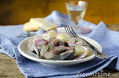 Salted herring with boiled potatoes and onions