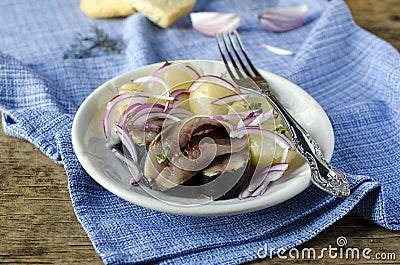 Salted herring with boiled potatoes and onions