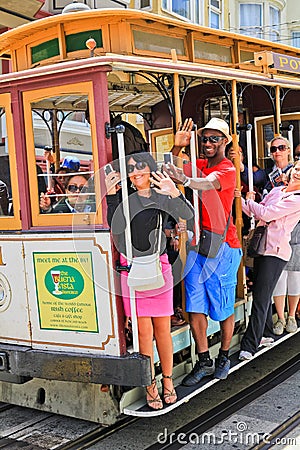 San Francisco Waving Cable Car Passengers