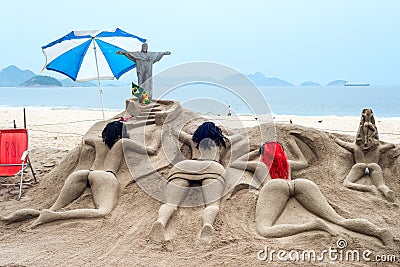 Sand sculpture sunbathe on the beach of Copacabana