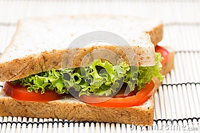 Sandwich with vegetables on bamboo