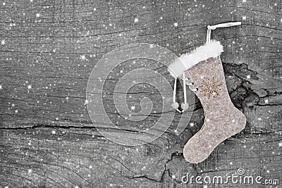 Santa or christmas boot on a wooden shabby chic background for a