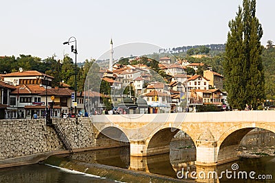 Sarajevo cityscape with the Miljacka river and a bridge