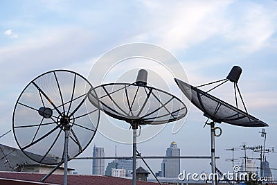 Satellite dishes antenna on roof top among the city