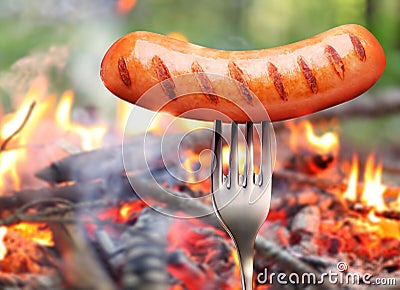 Sausage on a fork.