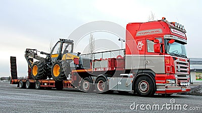 Scania R500 Truck Hauling a Forest Harvester