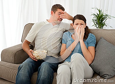 http://thumbs.dreamstime.com/x/scared-couple-watching-horror-movie-17278991.jpg