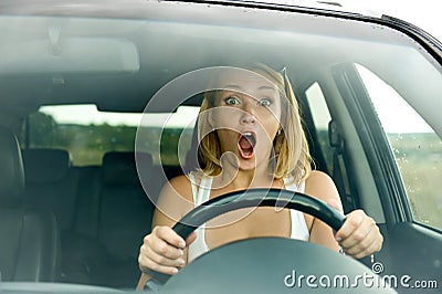 Scared woman shouts driving the car